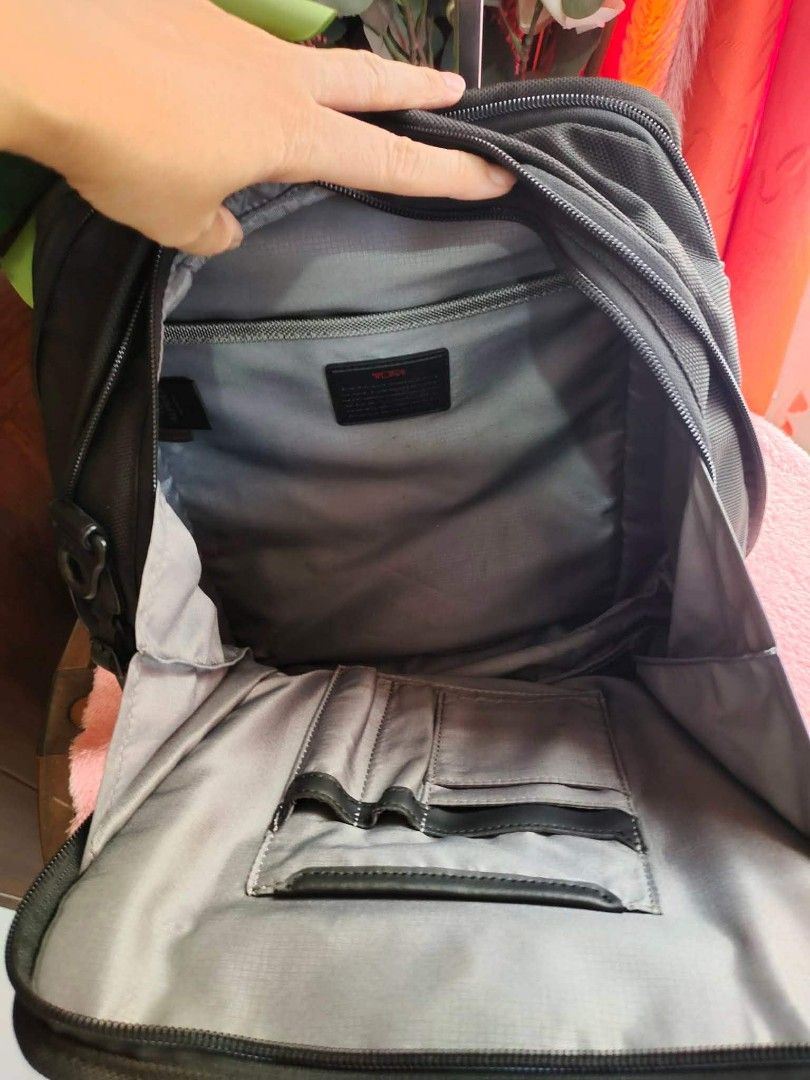 Tumi Alpha 2 Tote Bag (Category: Luxury Bags & Wallets) located in Cebu City. Submitted by tlisurplus (Listing ID 1438813897, Image 3). Description: - Black Tumi Alpha 2 tote bag - Main compartment with multiple pockets - Includes a detachable luggage tag - Features a top handle and a shoulder strap - Made in China - Gray interior lining.