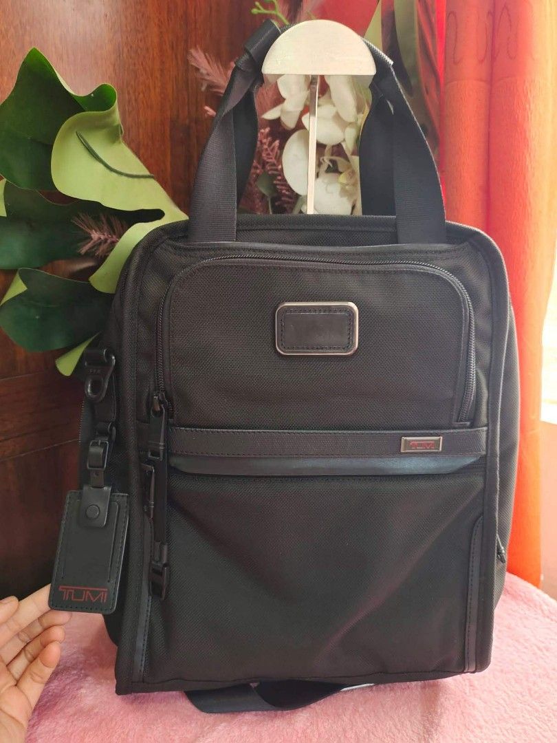 Tumi Alpha 2 Tote Bag (Category: Luxury Bags & Wallets) located in Cebu City. Submitted by tlisurplus (Listing ID 1438813897, Image 1). Description: - Black Tumi Alpha 2 tote bag - Main compartment with multiple pockets - Includes a detachable luggage tag - Features a top handle and a shoulder strap - Made in China - Gray interior lining.