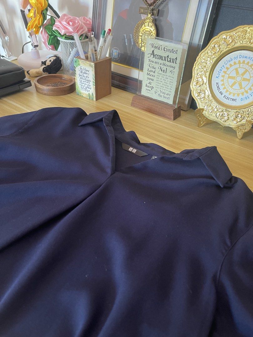 Uniqlo Navy Blouse - Size M (Category: Blouses) located in Manila. Submitted by abby_0101 (Listing ID 1438713531, Image 3). Description: - Uniqlo navy blue blouse - Size: M - Features a collared neckline - Relaxed fit - Versatile for casual and office wear - Simple and elegant design - Made of smooth, lightweight fabric.