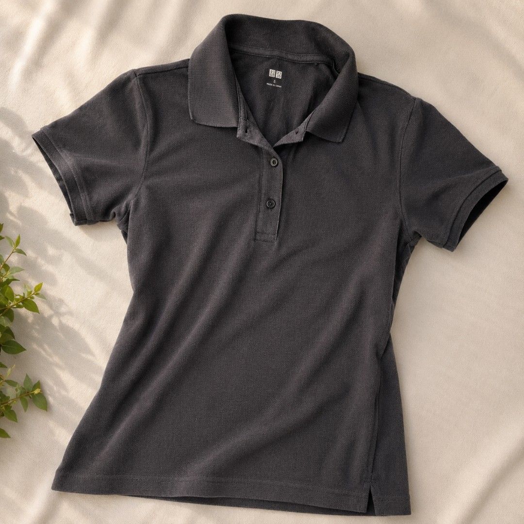 Uniqlo Polo Shirt (Category: Shirts) located in Manila. Submitted by ayyafinds (Listing ID 1438786206, Image 2). Description: - Uniqlo polo shirt - Collared neckline - Button-down closure - Short sleeves - Regular fit - Textured fabric - Colors: Black - Perfect for casual and smart-casual outfits.