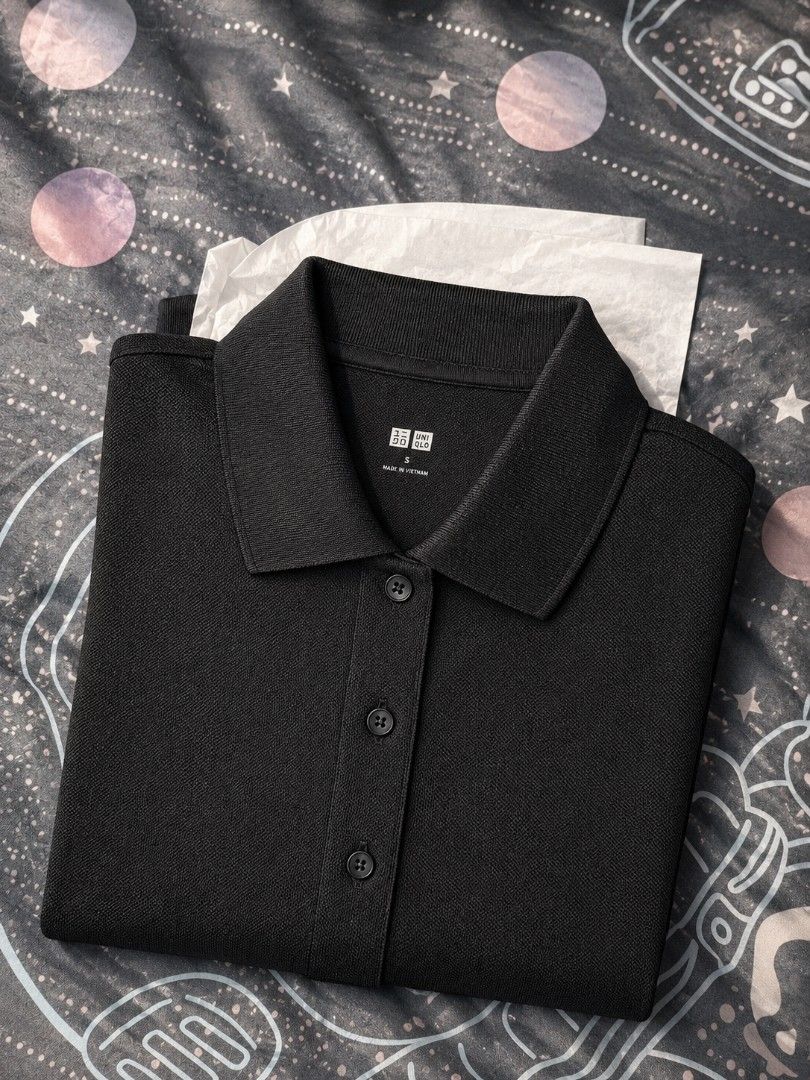 Uniqlo Polo Shirt (Category: Shirts) located in Manila. Submitted by ayyafinds (Listing ID 1438786206, Image 1). Description: - Uniqlo polo shirt - Collared neckline - Button-down closure - Short sleeves - Regular fit - Textured fabric - Colors: Black - Perfect for casual and smart-casual outfits.