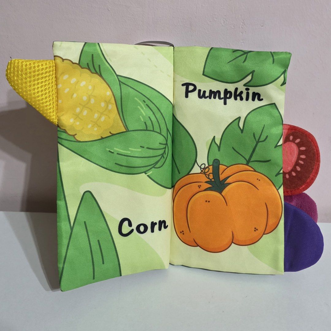 Vegetable Tails Book, Xylophone, and Stacking Toy (Category: Educational & Learning Toys) located in Plaridel. Submitted by chyambee (Listing ID 1438877057, Image 2). Description: - Vegetable Tails fabric book featuring corn, pumpkin, eggplant, tomato, onion, and carrot illustrations. - Rainbow-colored xylophone with two mallets. - Wooden stacking toy with colorful rings. - Perfect for toddlers!.