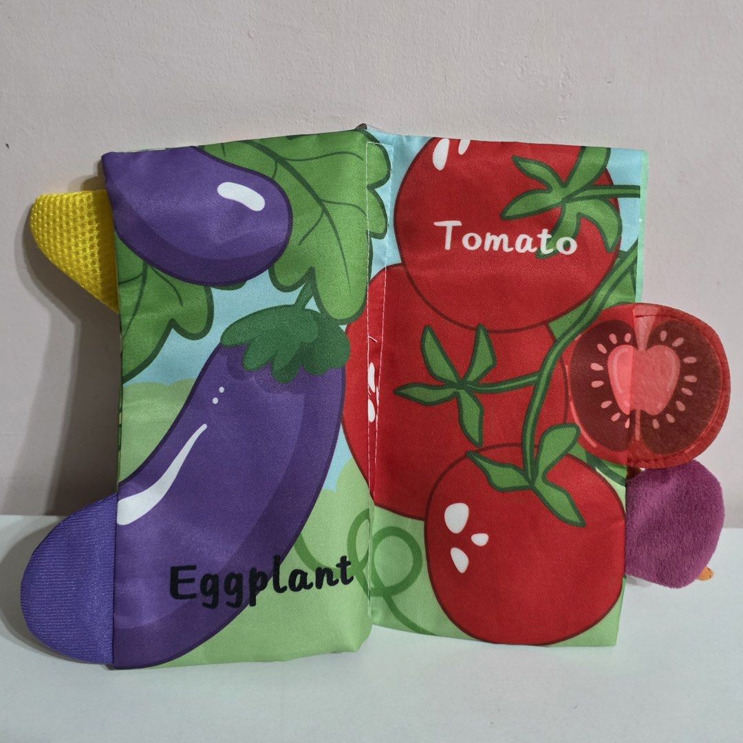 Vegetable Tails Book, Xylophone, and Stacking Toy (Category: Educational & Learning Toys) located in Plaridel. Submitted by chyambee (Listing ID 1438877057, Image 3). Description: - Vegetable Tails fabric book featuring corn, pumpkin, eggplant, tomato, onion, and carrot illustrations. - Rainbow-colored xylophone with two mallets. - Wooden stacking toy with colorful rings. - Perfect for toddlers!.