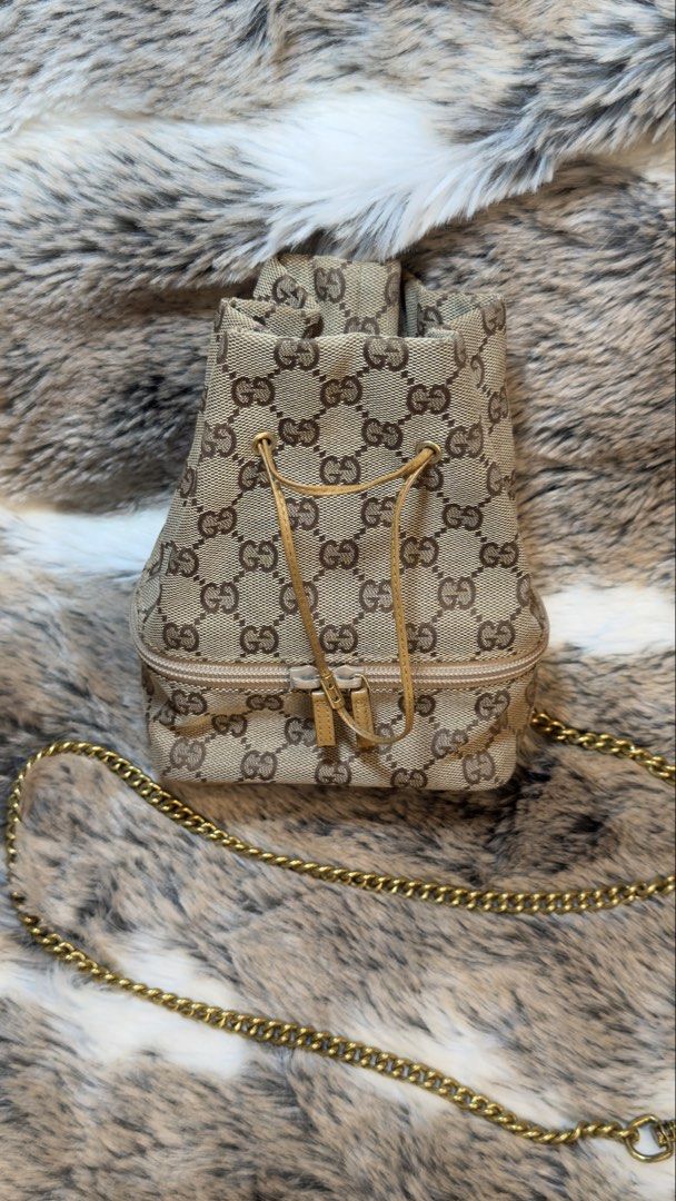 Vintage Gucci DrawString Mini Bucket Bag (Category: Luxury Bags & Wallets) located in Manila. Submitted by wisetree.71201a (Listing ID 1438869515, Image 1). Description: 🎀This bag is very cute, iconic and timeless piece. Can wear everyday. —come with Original Dust Bag —canvas material —measurements w14.5 x h18 x d8.5 (cm) ❤️this items are cleaned inside and out. .