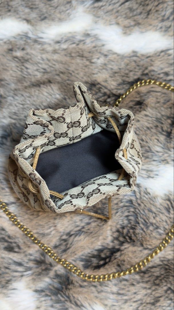 Vintage Gucci DrawString Mini Bucket Bag (Category: Luxury Bags & Wallets) located in Manila. Submitted by wisetree.71201a (Listing ID 1438869515, Image 2). Description: 🎀This bag is very cute, iconic and timeless piece. Can wear everyday. —come with Original Dust Bag —canvas material —measurements w14.5 x h18 x d8.5 (cm) ❤️this items are cleaned inside and out. .