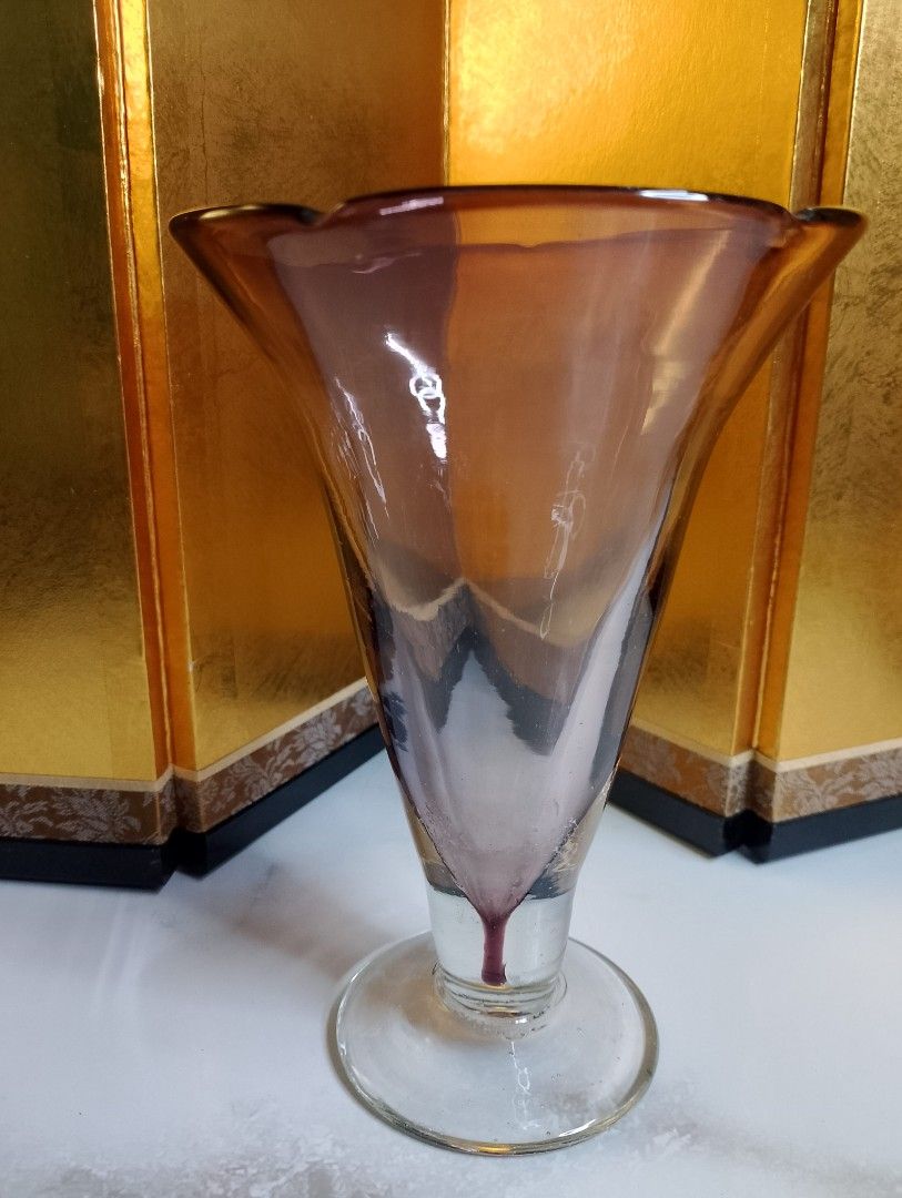 Vintage Handblown Glass Vase (Category: Vases & Decorative Bowls) located in Valenzuela. Submitted by buylaaaaa (Listing ID 1438784911, Image 2). Description: - Vintage glass vase - Unique shape and color gradient - Brown and purple hues - Flared top with scalloped rim - Clear base - Approximately 8 inches tall - 5 inches diameter at the top.
