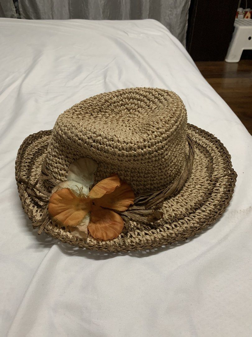 Woven Straw Hat with Flower for Summer and Beach (Category: Hats & Beanies) located in Quezon City. Submitted by thriftythought (Listing ID 1438794892, Image 1). Description: - Woven straw hat - Wide brim - Comfortable fit - Natural straw color with brown trim - Decorative flower in orange and cream - Ideal for outdoor activities.