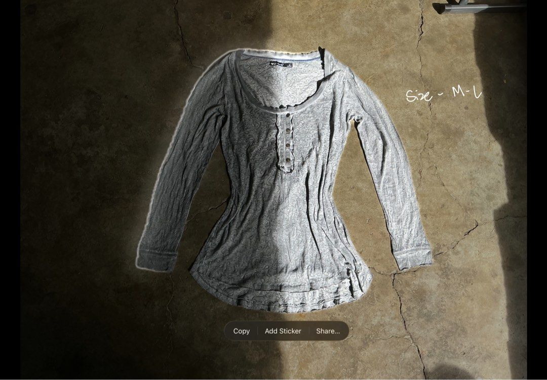 Y2k Gray Long Sleeve henley Top (Category: Longsleeves) located in San Pablo. Submitted by rushnthrift (Listing ID 1438739197, Image 2). Description: - Gray long-sleeved top - Button-down design - Scoop neckline - Fitted silhouette - Made of soft, comfortable material - Versatile for casual outfits - Easy to pair with different bottoms.