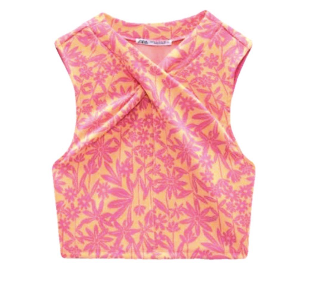 Zara Floral Twist Crop Top (Category: Sleeveless) located in Manila. Submitted by trishaaysobel (Listing ID 1438739996, Image 1). Description: - Zara crop top - Vibrant pink and orange floral print - Unique twist detail at the front - Sleeveless design.