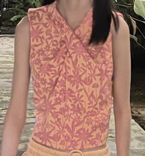 Zara Floral Twist Crop Top (Category: Sleeveless) located in Manila. Submitted by trishaaysobel (Listing ID 1438739996, Image 3). Description: - Zara crop top - Vibrant pink and orange floral print - Unique twist detail at the front - Sleeveless design.