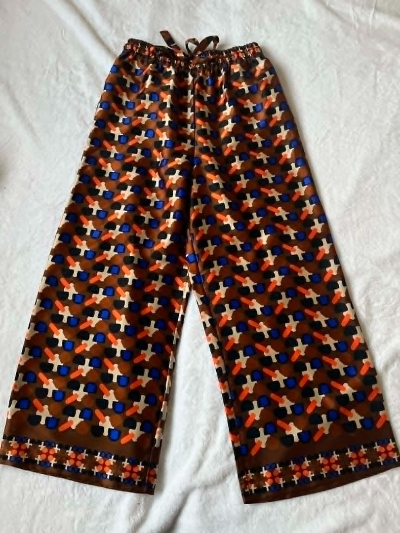 Zara Geometric Matching Set (Category: Sets or Coordinates) located in Pasig City. Submitted by closet_reframe (Listing ID 1438829315, Image 3). Description: Like new, used once only. Zara Printed matching set, lightweight satin-like fabric that feels smooth and comfortable on the skin. material drapes nicely and the print looks clean and well made in person. No issues or stains noticed, still in excellent condition. Bag and shoes are also for sa
