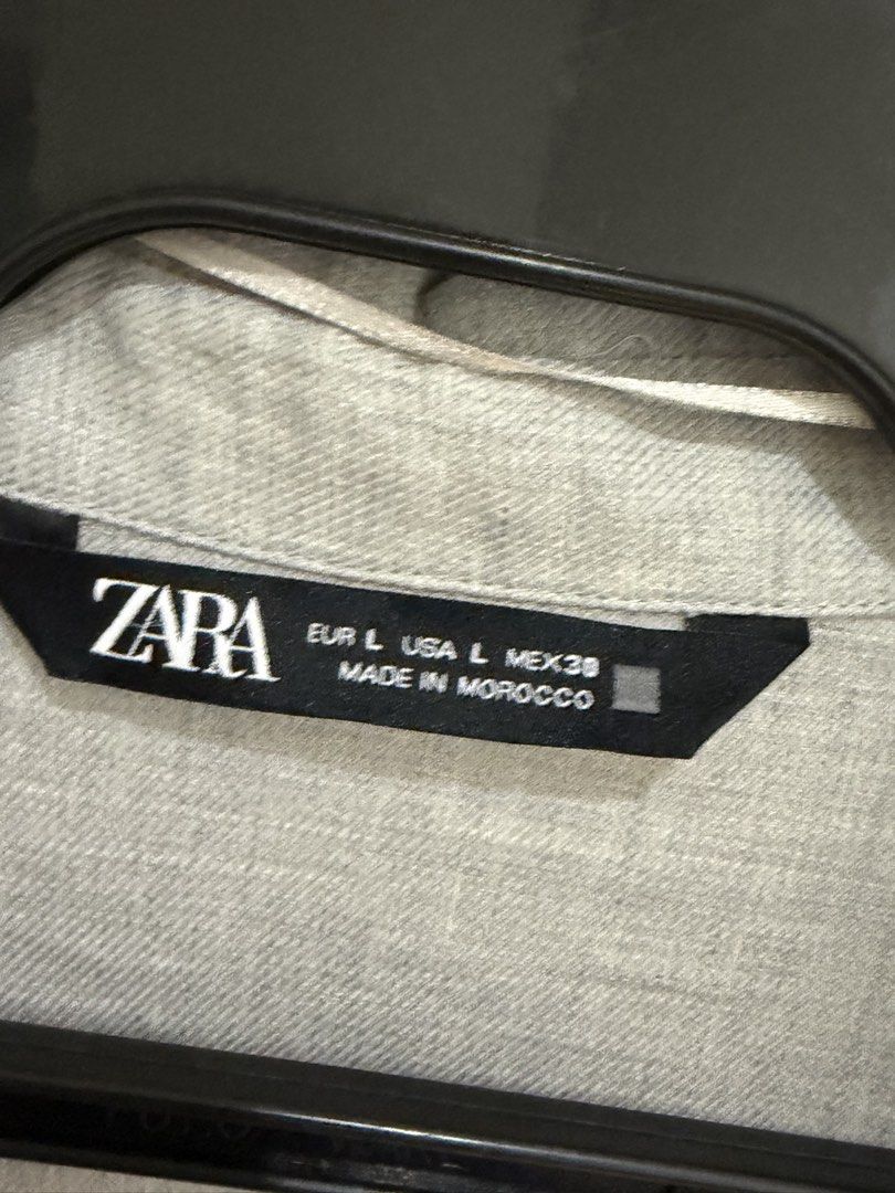 Zara Linen Shirt - Size L (Category: Shirts) located in Makati City. Submitted by delr2191 (Listing ID 1438741298, Image 2). Description: - Zara linen shirt - Color: Light gray - Size: L - Features: Collared neckline, button-down closure, chest pocket - Sleeves can be rolled up - Made in Morocco Used 2x.