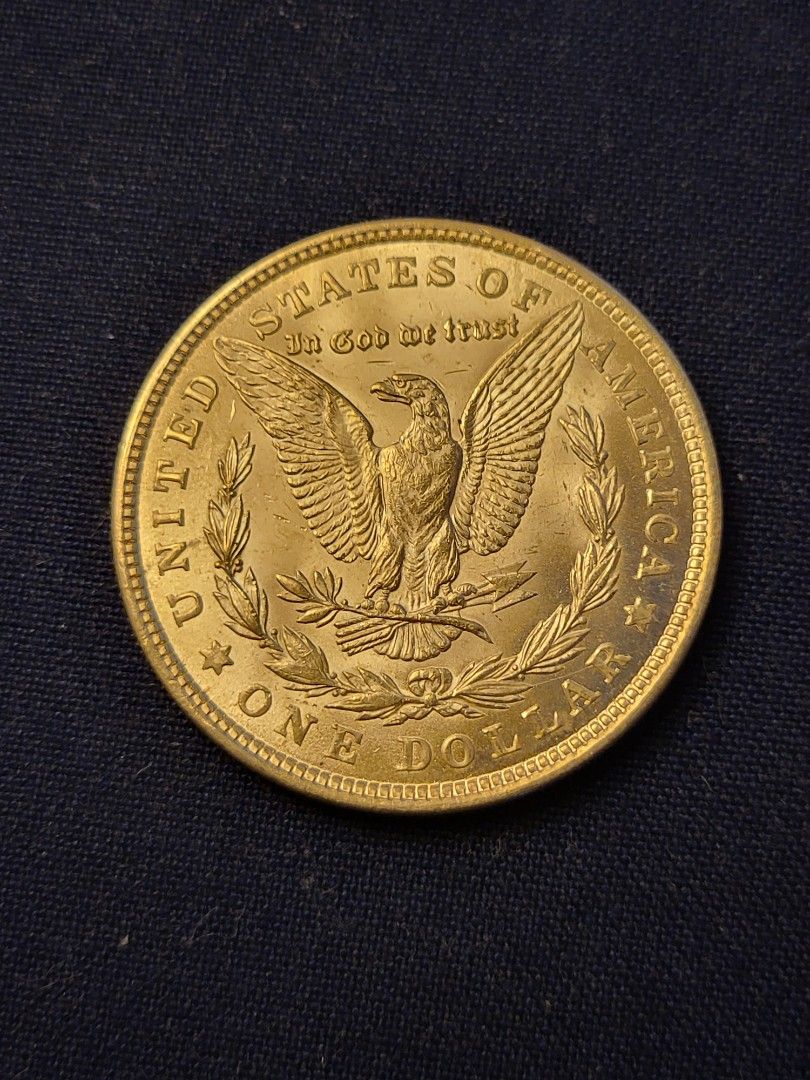 1921 p Unc Morgan silver dollar (Category: Currency) located in Caloocan City. Submitted by swiftfish.d72520 (Listing ID 1435559606, Image 2). Description: 1921 p Unc Morgan Silver Dollar 90% silver. Hard to find in this condition. In protective capsule. Mailing is not available for this item Cash only will meet.PICK UP ONLY. Contact # 09681109587. The gold color is the lighting effect when this was taken. Good luck.