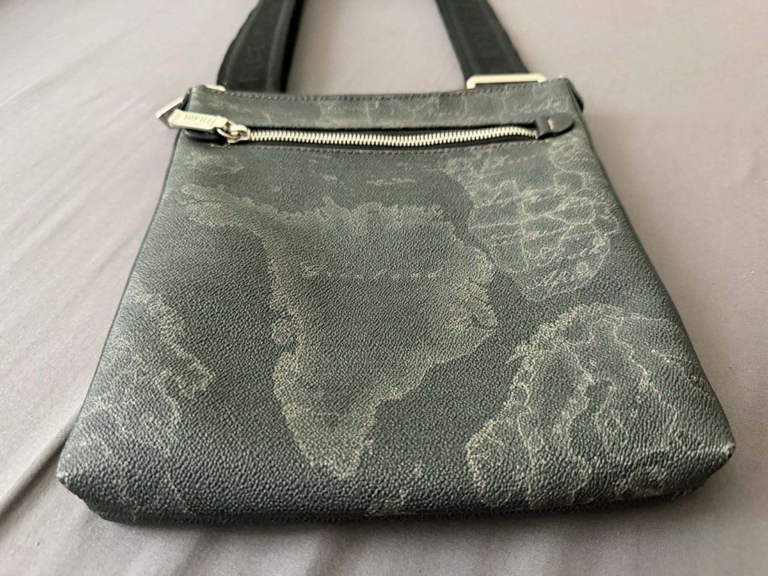 1A Classe Geo Map Crossbody Bag (Category: Sling Bags) located in Manila. Submitted by artyreal (Listing ID 1435637924, Image 1). Description: - Stylish crossbody bag - Unique geo map design - Zip closure - Adjustable strap with brand name - Small exterior zip pocket - Branded interior tag - Made of textured material.