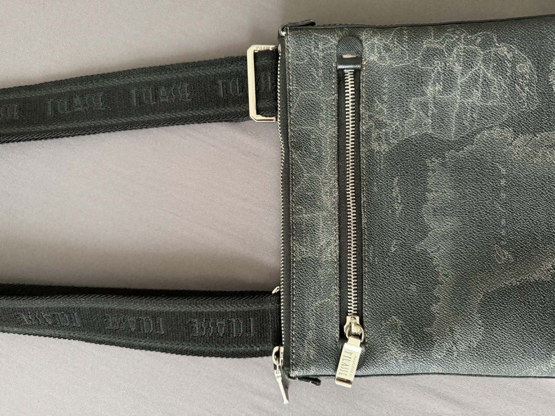 1A Classe Geo Map Crossbody Bag (Category: Sling Bags) located in Manila. Submitted by artyreal (Listing ID 1435637924, Image 2). Description: - Stylish crossbody bag - Unique geo map design - Zip closure - Adjustable strap with brand name - Small exterior zip pocket - Branded interior tag - Made of textured material.