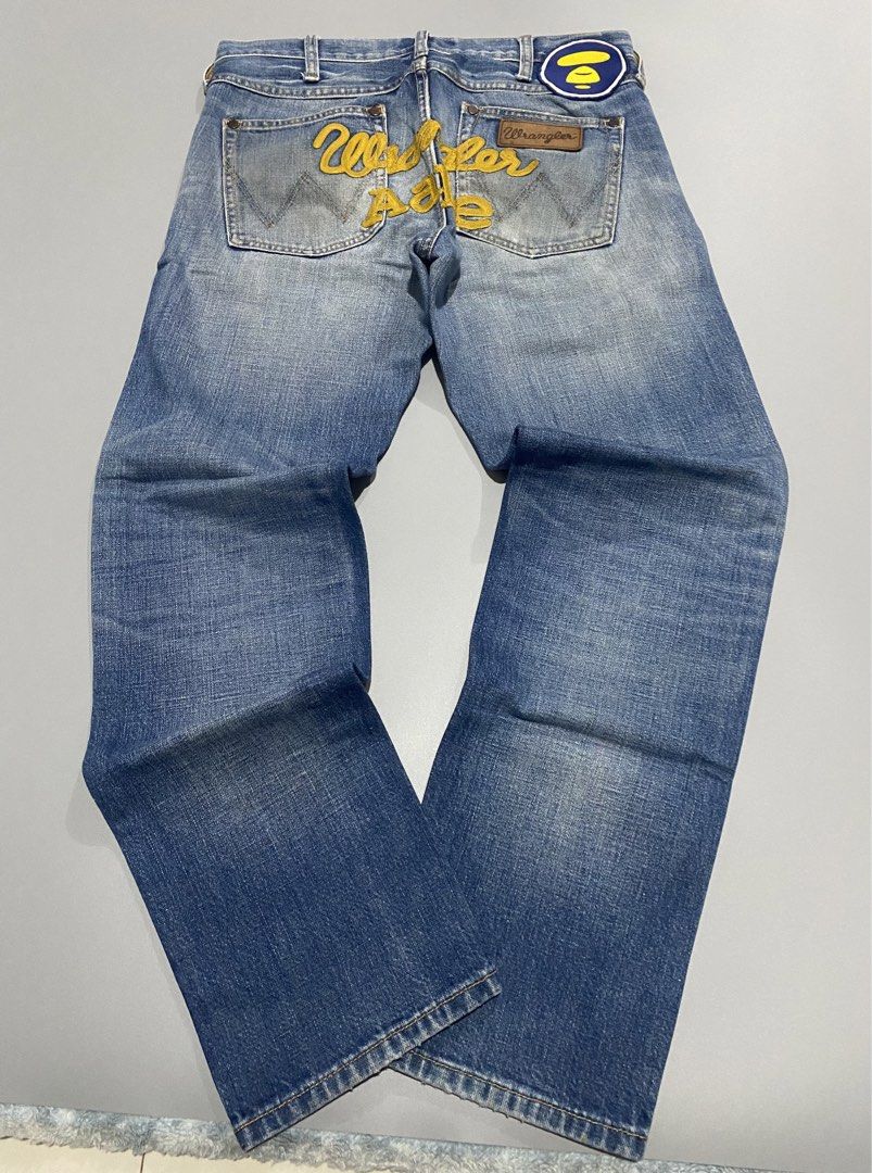 AAPE x WRANGLER - DENIM PANTS (Category: Jeans) located in Naga. Submitted by junked_garments (Listing ID 1435571232, Image 1). Description: AAPE x WRANGLER - DENIM PANTS 9/10 CONDITION NO ISSUE MEASUREMENTS: WAIST: 31” LENGTH: 38” HEM: 7” DM ME TO PURCHASE!.