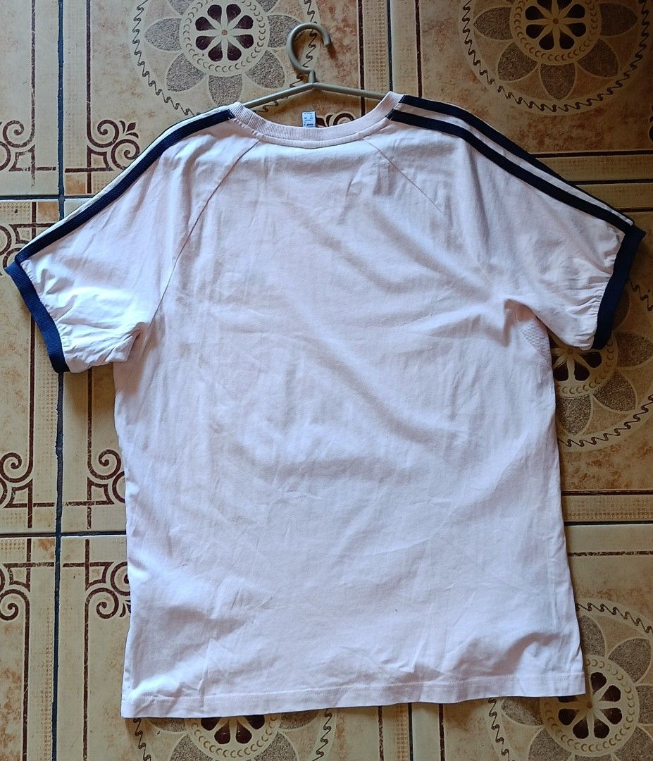 Adidas 3-Stripes T-Shirt (Category: Tshirts & Polo Shirts ) located in Manila. Submitted by hazelicious21 (Listing ID 1435608754, Image 3). Description: - Adidas t-shirt - Light pink color - Navy blue accents - Iconic 3-stripes on sleeves - Adidas logo on chest - Crew neck and short sleeves - Model number: IC5539.