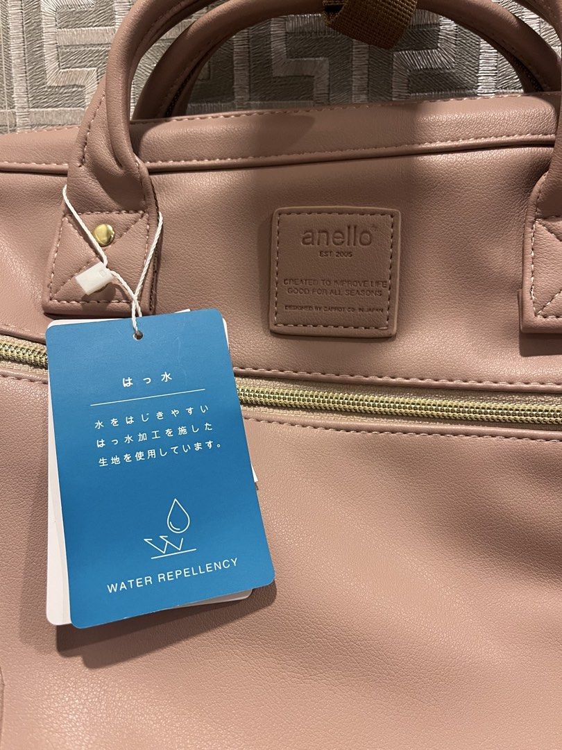 Anello Retro 3-way Bag (Category: Backpacks) located in Pasig City. Submitted by jackiedla (Listing ID 1435656308, Image 2). Description: - Anello handbag in dusty rose - Water-repellent design - Main compartment with zipper closure - Front pocket - Top handles - Detachable shoulder strap - Includes tag indicating water repellency.