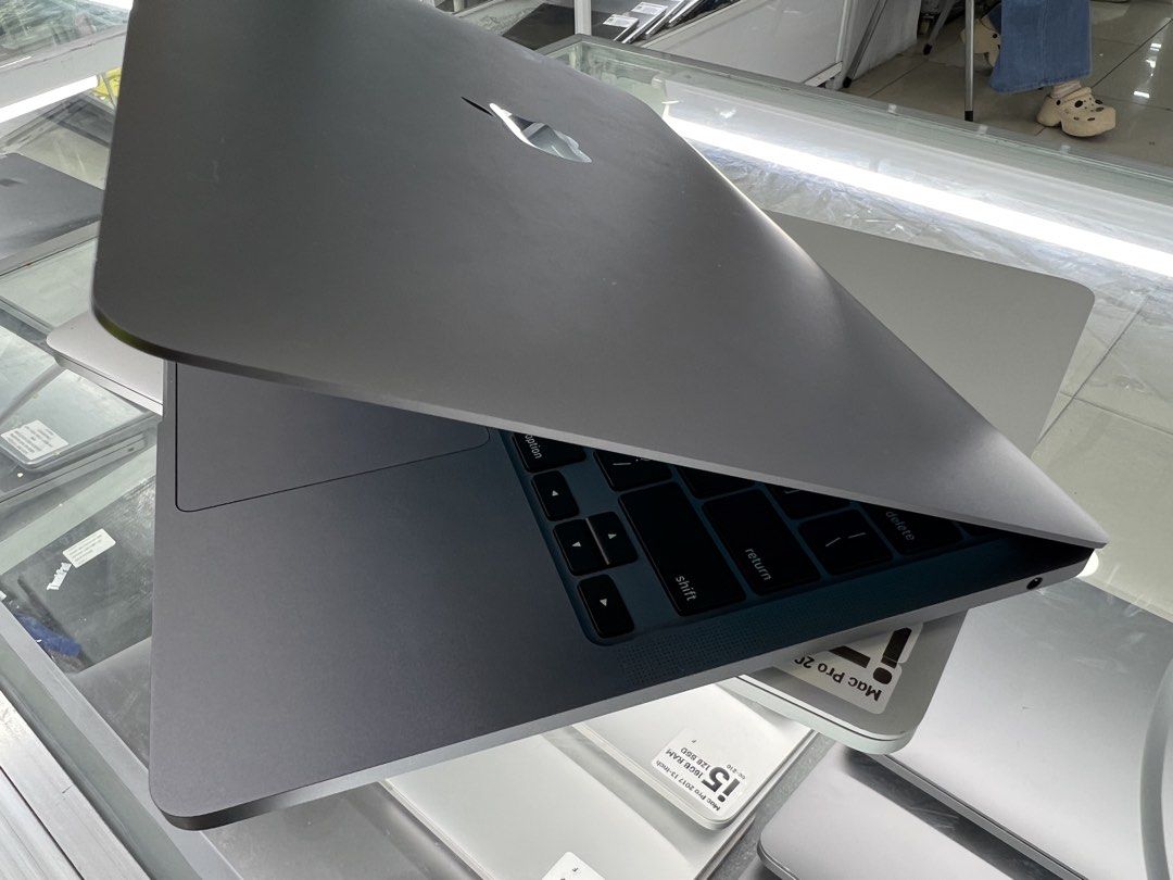 Apple MacBook Pro (Category: Laptops & Notebooks) located in Manila. Submitted by vaniextura (Listing ID 1435618457, Image 3). Description: - Space gray MacBook Pro - chip apple M1 - memory 16gb -storage 1Tb - cc 91 -max capacity 84% - Backlit keyboard - macOS display - Includes charging cable - Apple logo visible.