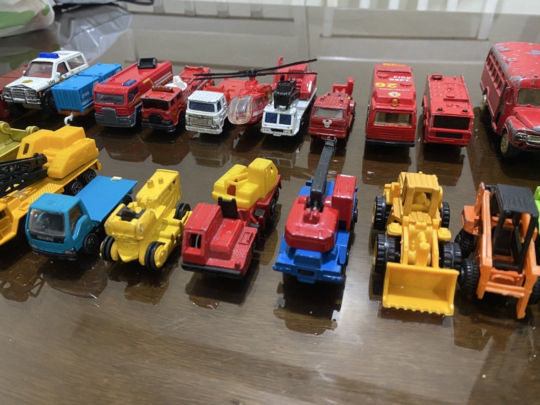 Assorted Diecast Toy Cars (Category: Vehicle & Diecast Models) located in Quezon City. Submitted by declutterthingzzz (Listing ID 1435712907, Image 1). Description: - Variety of diecast toy cars: fire trucks, police cars, construction vehicles, and a helicopter. - Features different colors and designs. - Detailed accessories like ladders and cranes. - Great for collectors and kids. Items are preloved/preowned/secondhand so limit your expectation.