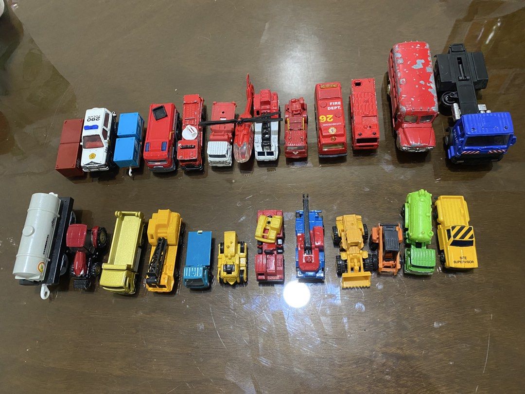 Assorted Diecast Toy Cars (Category: Vehicle & Diecast Models) located in Quezon City. Submitted by declutterthingzzz (Listing ID 1435712907, Image 3). Description: - Variety of diecast toy cars: fire trucks, police cars, construction vehicles, and a helicopter. - Features different colors and designs. - Detailed accessories like ladders and cranes. - Great for collectors and kids. Items are preloved/preowned/secondhand so limit your expectation.
