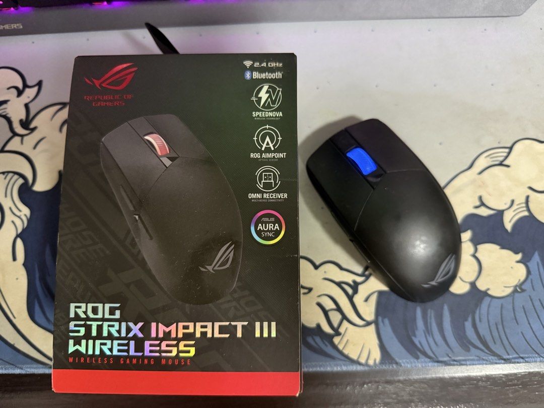 ASUS ROG Strix Impact III Wireless Gaming Mouse (Category: Mouse & Mousepads) located in Tagbilaran City. Submitted by rukawajbc (Listing ID 1435627015, Image 1). Description: - Wireless gaming mouse with 2.4 GHz and Bluetooth connectivity. - Features Speednova technology for fast and stable connection. - Equipped with ROG Aimpoint sensor for precision. - Includes Omni receiver. - Supports Aura Sync for customizable lighting. - Showcases the icon