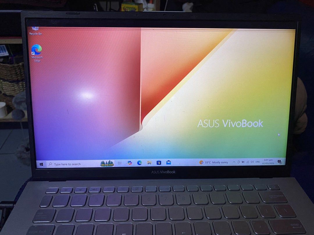 ASUS Vivobook Laptop (Category: Laptops & Notebooks) located in Paranaque City. Submitted by coolaj (Listing ID 1435617625, Image 2). Description: - ASUS Vivobook laptop - Intel Core i7 processor - 1920 x 1080 display resolution - Silver color - Keyboard and touchpad visible - Screen displays Windows settings - Comes with Orig charger ISSUE: Need palitan LCD has visible scratches sa front Rfs: Need funds .