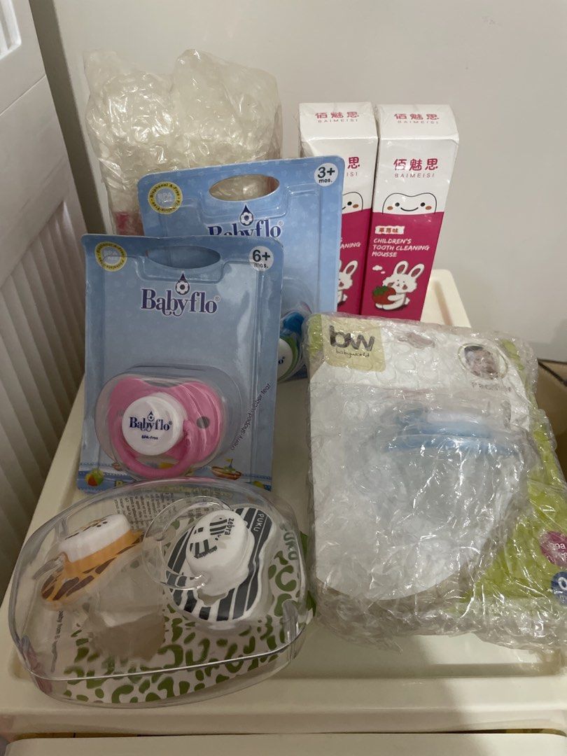 Baby Bundle (6 Toothpastes & 6 Pacifiers) (Category: Baby Toiletries & Grooming) located in Pasay City. Submitted by mamapeihan (Listing ID 1435659826, Image 1). Description: Bundle of pacifiers and tooth cleaning mousse. Includes Baby Flo pacifiers (3+ and 6+ months), Puku pacifiers (zebra and giraffe designs), and Baimeisi Children's Tooth Cleaning Mousse. The pacifiers are in their original packaging. The tooth cleaning mousse is also new..