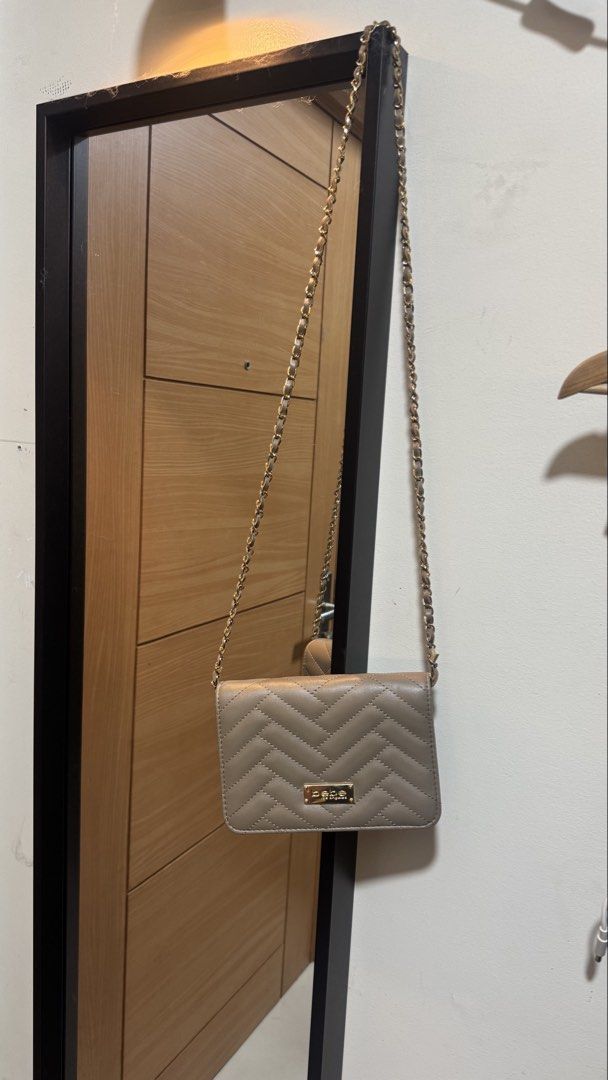Bebe long strap bag (Category: Cross-body Bags) located in Taguig. Submitted by kimdeclutterss (Listing ID 1435627348, Image 2). Description: Used 3-4x for parties Rfs: natatambak nalanggg Bought from US Last photo for flaws, may part ng lining na naremove ang leather, but barely notice noticeable because nasa ilalim siya.