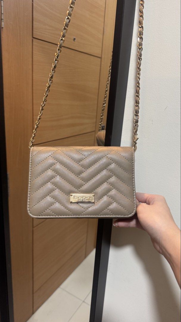 Bebe long strap bag (Category: Cross-body Bags) located in Taguig. Submitted by kimdeclutterss (Listing ID 1435627348, Image 1). Description: Used 3-4x for parties Rfs: natatambak nalanggg Bought from US Last photo for flaws, may part ng lining na naremove ang leather, but barely notice noticeable because nasa ilalim siya.