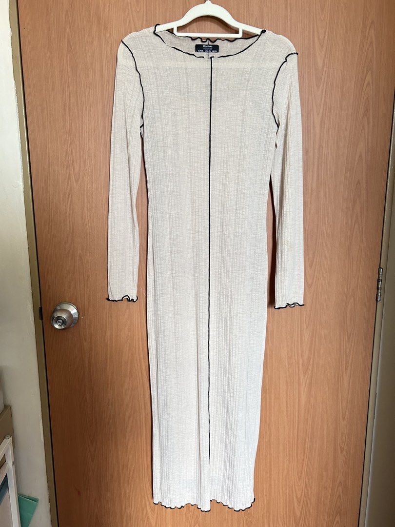 Bershka Long Sleeve Dress (Category: Dresses) located in Paranaque City. Submitted by unleashedcollections (Listing ID 1435589607, Image 2). Description: - Bershka long sleeve dress - Color: Beige with black trim - Features a scoop neckline - Fitted silhouette - Vertical seam detail -With Inner Fitted Dress (not attached) - Made in Turkey - Size: EUR XS, USA XS, MEX 24.