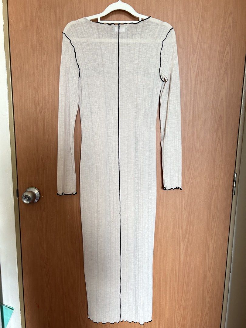 Bershka Long Sleeve Dress (Category: Dresses) located in Paranaque City. Submitted by unleashedcollections (Listing ID 1435589607, Image 3). Description: - Bershka long sleeve dress - Color: Beige with black trim - Features a scoop neckline - Fitted silhouette - Vertical seam detail -With Inner Fitted Dress (not attached) - Made in Turkey - Size: EUR XS, USA XS, MEX 24.
