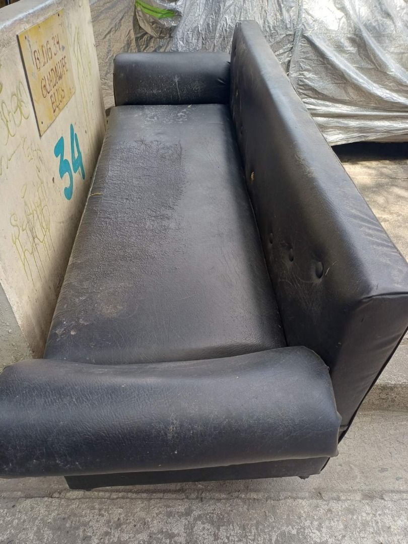 Black Sofa (Category: Sofas) located in Manila. Submitted by lcsebastia38580 (Listing ID 1435614005, Image 2). Description: - Black sofa - Rectangular shape - Features armrests - Made with a leather-like material - Button-detailed backrest - For indoor use.