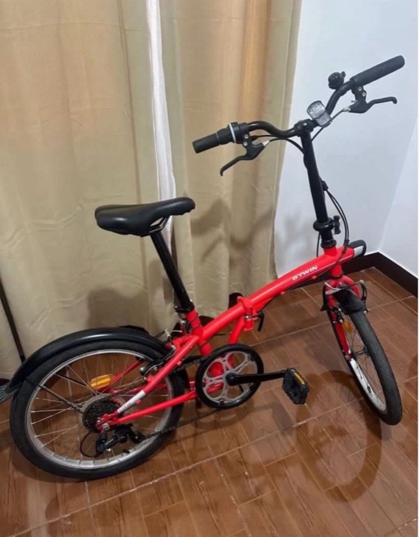Btwin Foldable Bike - Red (Category: Bicycles) located in Caloocan City. Submitted by eunoshop (Listing ID 1435636246, Image 1). Description: Btwin Foldable Red Bike 📌 Condition: In Good condition 📌Issue: Needs tune in and back wheels is flat. You will be the one to shoulder and responsible to fix that but all in all it is good. No major damage. 📌 Reason for Selling (RFS): Need funds 💰 Price: ₱9,000 🔹 Brand: Btwin 📍 Meetup: Capitol Park Hom