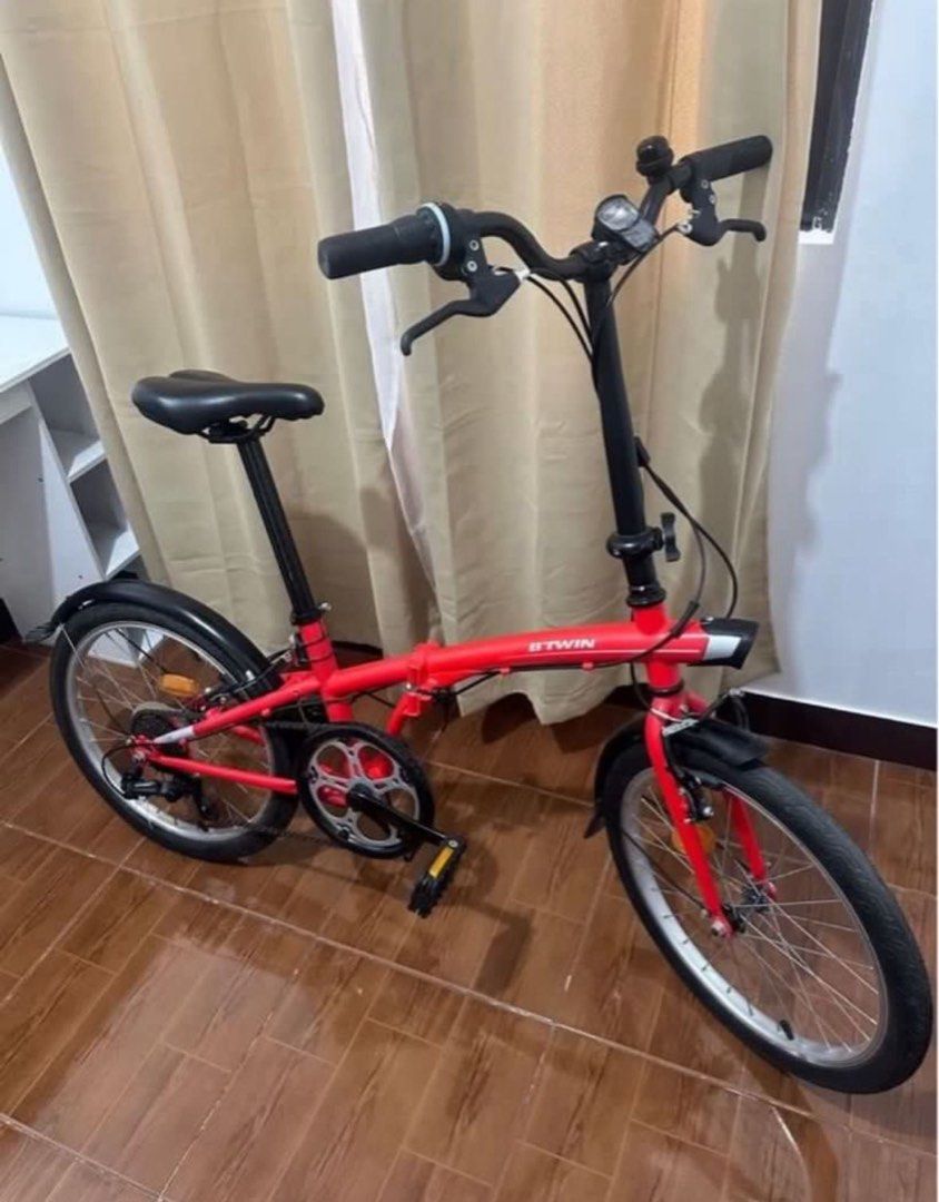 Btwin Foldable Bike - Red (Category: Bicycles) located in Caloocan City. Submitted by eunoshop (Listing ID 1435636246, Image 2). Description: Btwin Foldable Red Bike 📌 Condition: In Good condition 📌Issue: Needs tune in and back wheels is flat. You will be the one to shoulder and responsible to fix that but all in all it is good. No major damage. 📌 Reason for Selling (RFS): Need funds 💰 Price: ₱9,000 🔹 Brand: Btwin 📍 Meetup: Capitol Park Hom