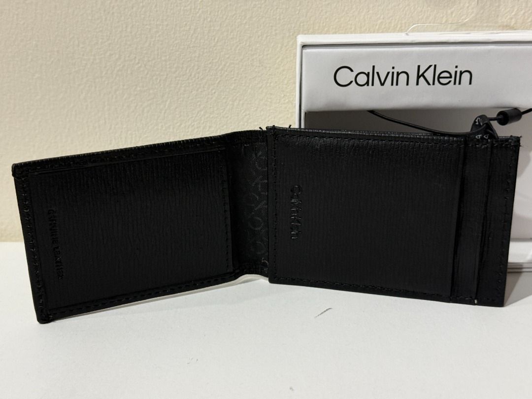 CALVIN KLEIN CK BLACK GENUINE LEATHER CARD CASE WALLET $50 (Category: Wallets & Card Holders) located in San Juan City. Submitted by thesouthbeachedit (Listing ID 1435623285, Image 3). Description: BRAND NEW WITH TAG! 100% AUTHENTIC FROM THE U.S.! CALVIN KLEIN CK BLACK LEATHER CARD CASE WALLET $50 STYLE: 31KA160001 Genuine Leather 5 credit card holders 1 ID card holder Magnetic snap closure Details: 4.25" Wide x 3" High DON'T LET THIS BEAUTIFUL I