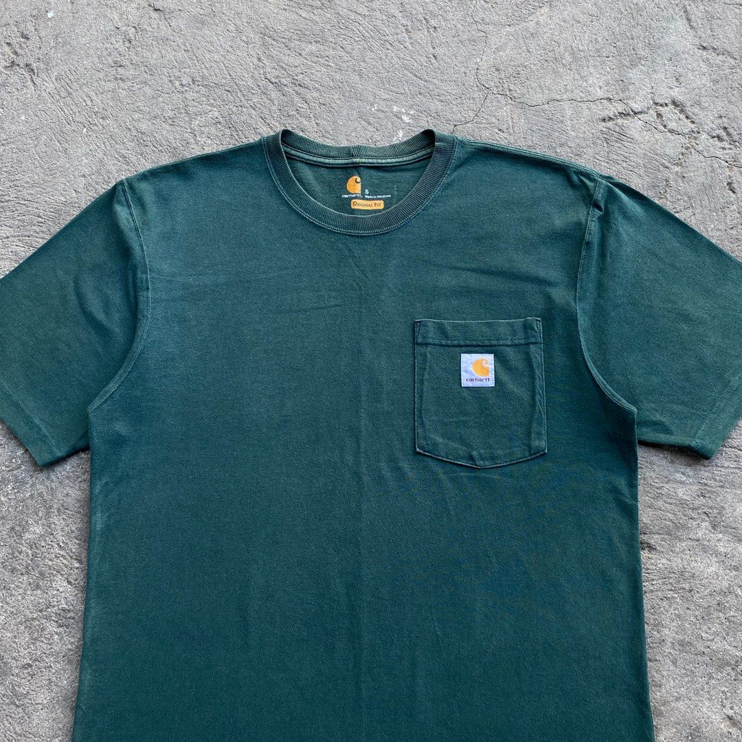 Carhartt Hunter Green Pocket Tee (Category: Tshirts & Polo Shirts ) located in Calamba. Submitted by thriftguide (Listing ID 1435633653, Image 2). Description: Carhartt Hunter Green Pocket Tee Authentic Excellent Condition Issue: May 1 maliit na butas sa hem Small on tag, Fits Large Width: 21” Length: 28.5”.