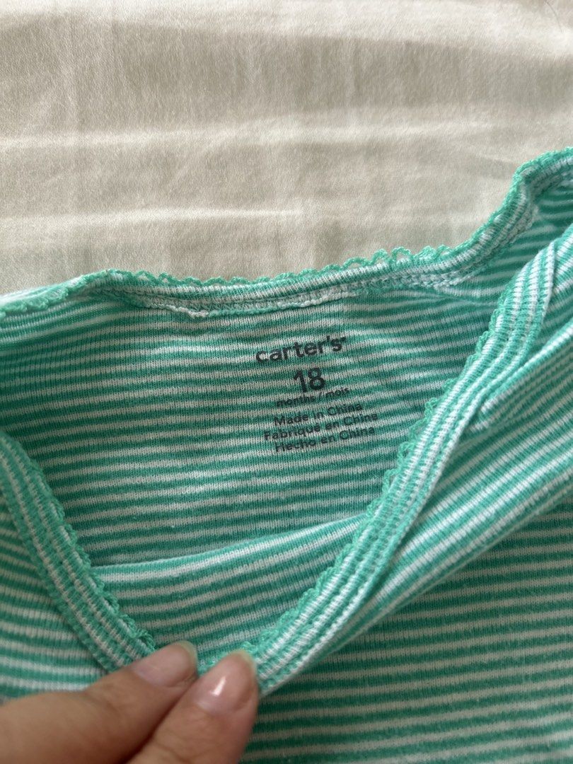 Carter's Striped Onesie - 18 Months (Category: Babies & Kids Fashion) located in Quezon City. Submitted by jen_o (Listing ID 1435529938, Image 2). Description: - Carter's onesie for 18-month-old babies. - Light blue and white stripes. - Short sleeves. - Convenient snap closures at the bottom. - Made from soft, comfortable fabric. - Perfect for daily use..