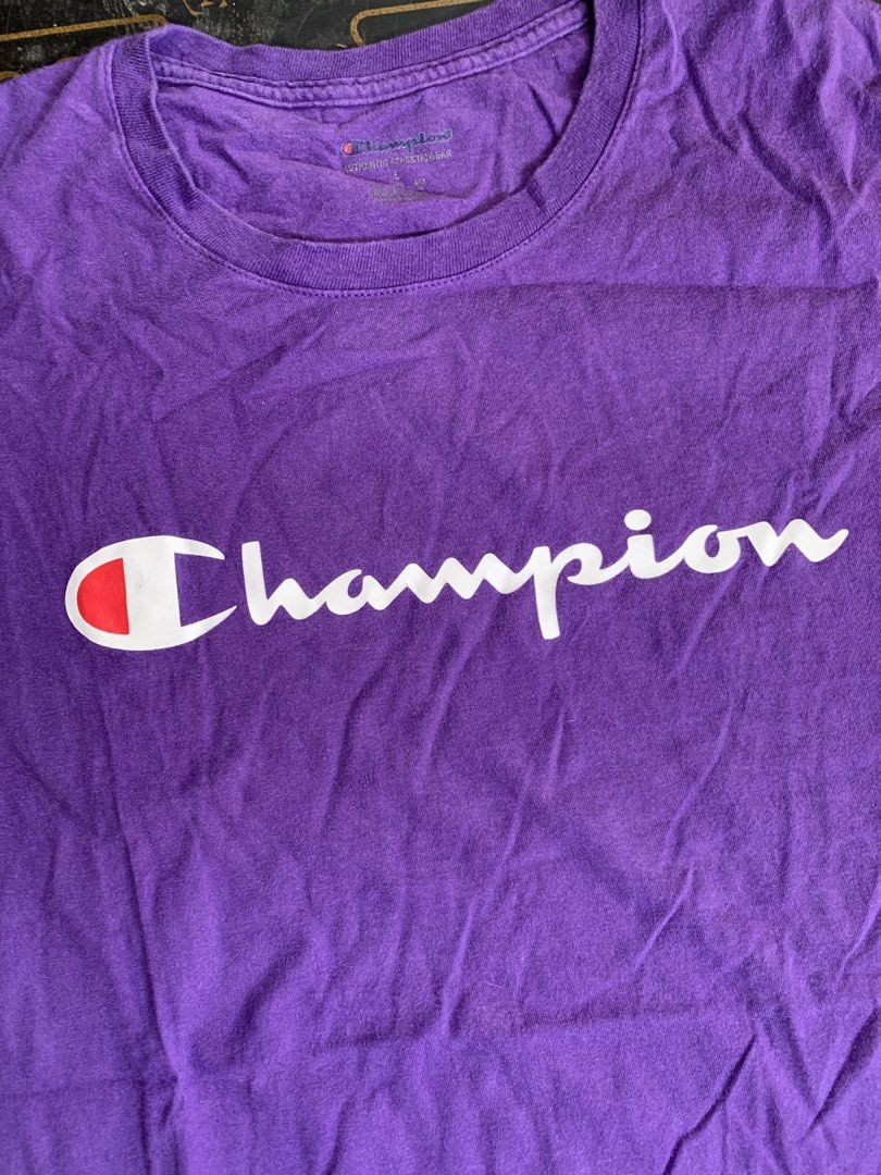 Champion Purple T-shirt (Category: Tshirts & Polo Shirts ) located in Baguio. Submitted by brix6699 (Listing ID 1435591814, Image 2). Description: - Purple Champion T-shirt - Champion logo on front - Small Champion logo on sleeve - Size: L - Made in Honduras -Dimension Length 28 inches Width 20.5 inches .