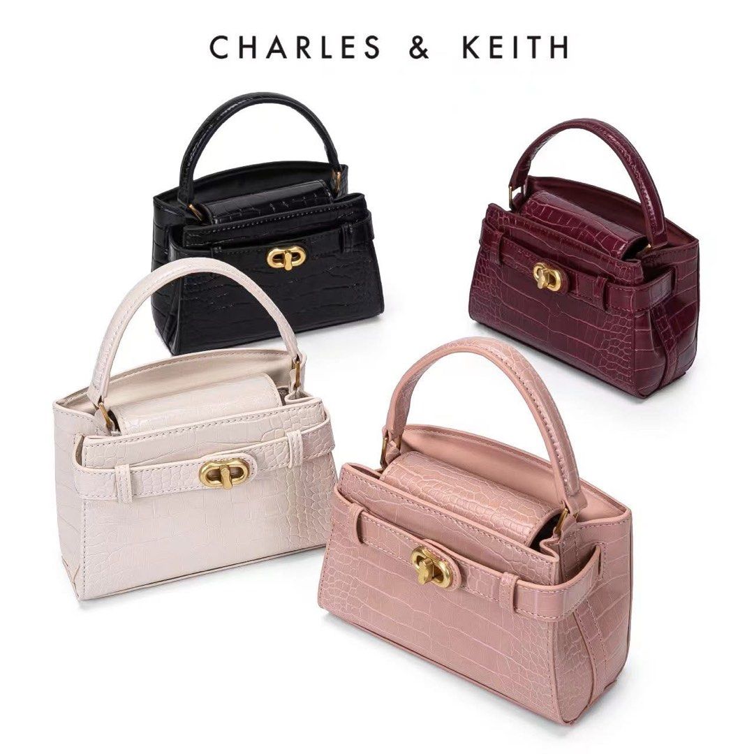 Charles & Keith Mini Top Handle Bag (Category: Luxury Bags & Wallets) located in Manila. Submitted by rcwluxx (Listing ID 1435674527, Image 1). Description: - Charles & Keith mini top handle bag - Crocodile-embossed finish - Available colors: Black, Burgundy, Cream, Pink - Secure clasp closure - Structured design - Compact size - Top handle - Small inner compartment - Perfect for essentials.