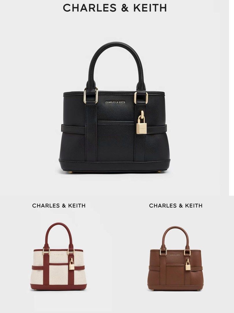 Charles & Keith Top Handle Bag (Category: Luxury Bags & Wallets) located in Manila. Submitted by rcwluxx (Listing ID 1435674413, Image 1). Description: - Charles & Keith top handle bag - Padlock detail - Available colors: Black, Brown, Cream/Burgundy - Structured design - Detachable strap included - Rectangular shape - Gold-tone hardware - Small logo detail.