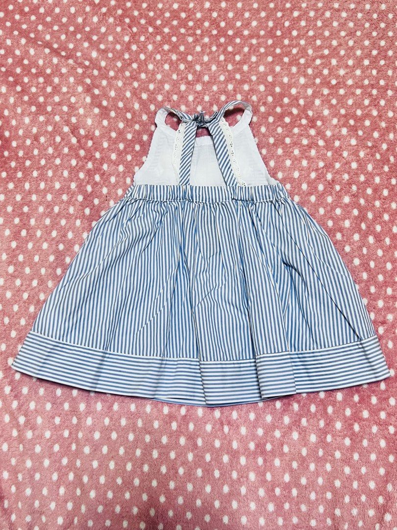 Classy Blue and White Striped Dress (Category: Babies & Kids Fashion) located in Manila. Submitted by definiens (Listing ID 1435656302, Image 2). Description: - US size 3T - Halter neck and backless - Bow detail at the back - Embroidered floral details on the front - Please note: light stain on the strap of the dress (haven’t tried spot cleaning washing yet).