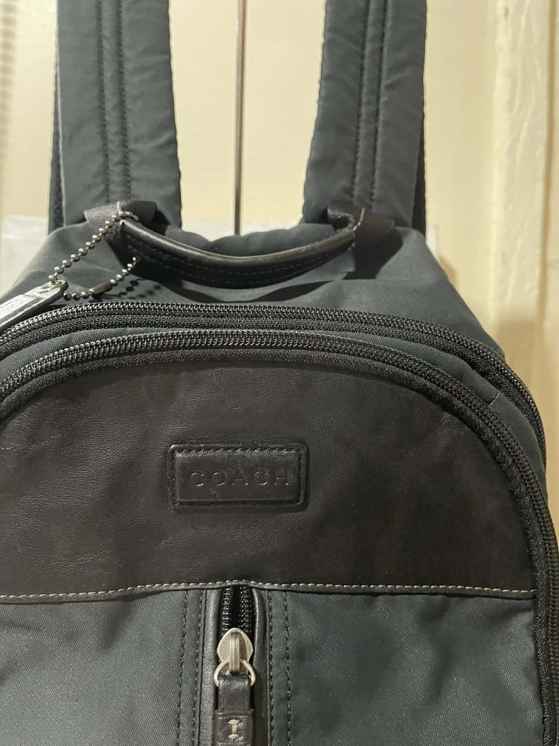Coach Varick Nylon Backpack Bag Original (Category: Backpacks) located in Naawan. Submitted by twillycalledprelovedbags (Listing ID 1435600138, Image 2). Description: issue: 2 missing rubber sa puller ykk zipper, creed.