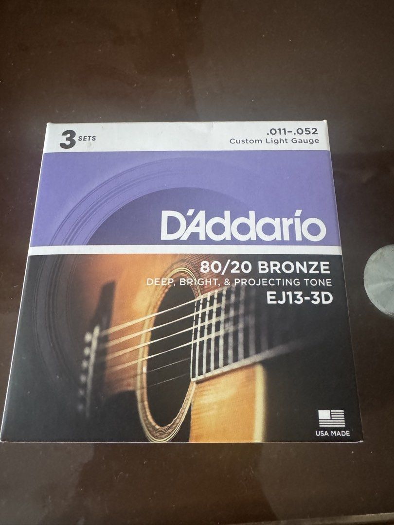 D'Addario EJ13-3D 80/20 Bronze Guitar Strings (Category: Musical Instruments) located in Manila. Submitted by cabbagepot (Listing ID 1435524979, Image 1). Description: 2 sets of the strings for 800 - EJ13-3D guitar strings - 80/20 Bronze construction - Custom light gauge (.011-.052) - Made in the USA - Produces a deep, bright, and projecting tone.