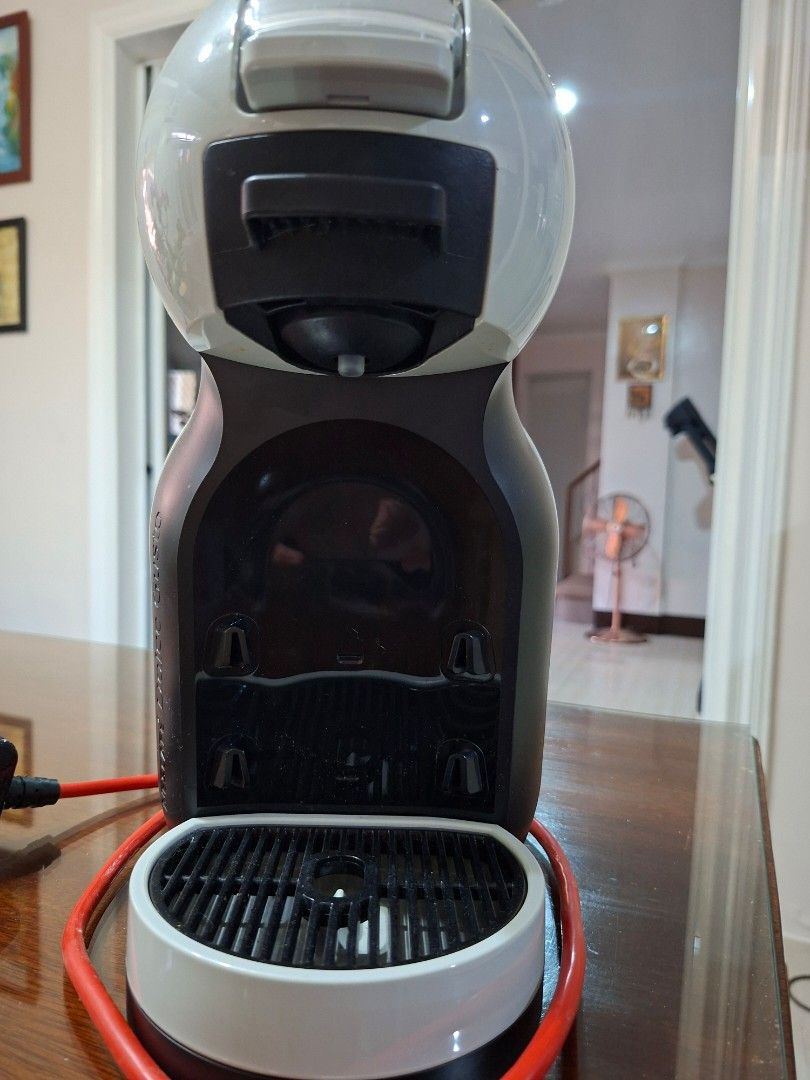Dolce Gusto Coffee Machine (Category: Coffee Machines & Makers) located in Manila. Submitted by cavitelady.1315 (Listing ID 1435590144, Image 2). Description: - Dolce Gusto coffee machine - Stylish white and black design - Transparent water reservoir - Includes capsule holder - Red power cord - Compact size, ideal for home - In good working order - Box no longer available.
