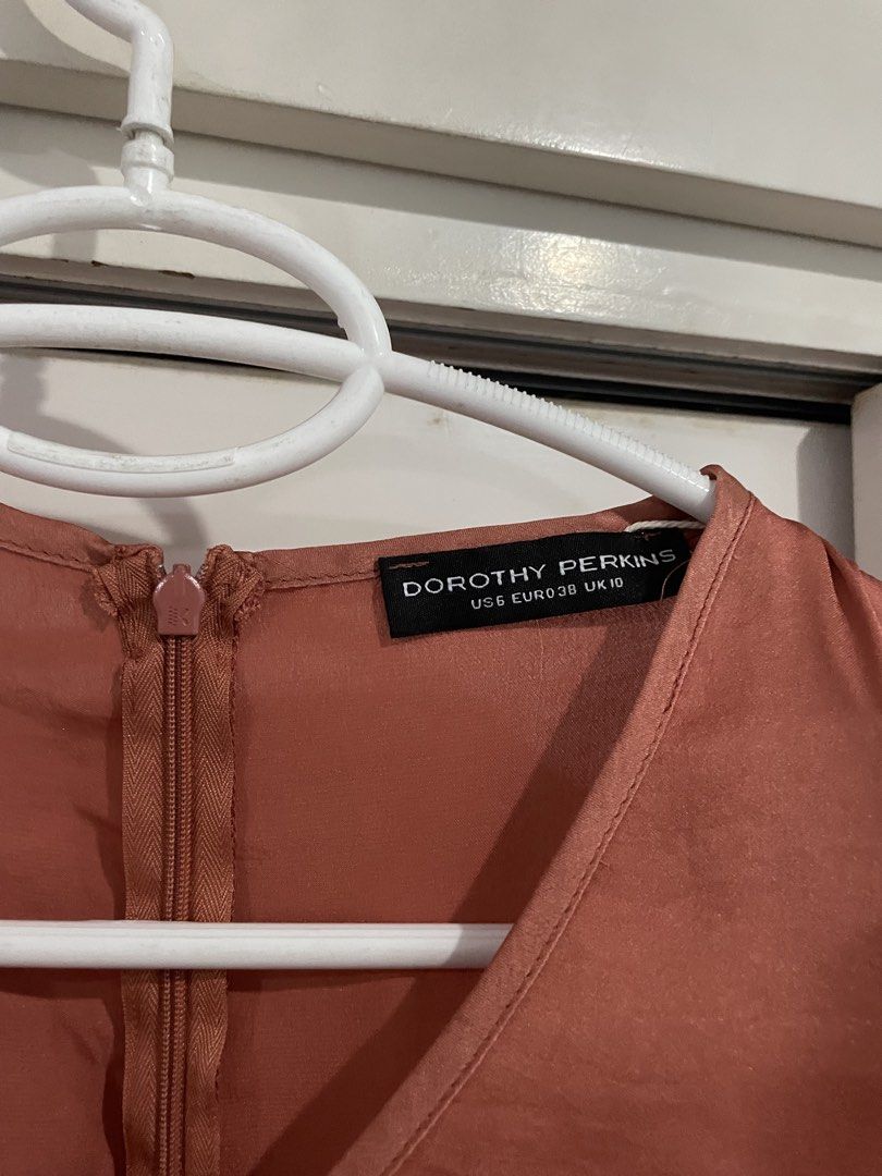 Dorothy Perkins Asymmetrical Dress (Category: Dresses) located in Makati City. Submitted by Pinksisters (Listing ID 1435640403, Image 3). Description: - Dorothy Perkins dress - V-neckline - Asymmetrical hem - Back zipper closure - Sleeveless - Solid color, satin-like material - US size 6, EUR 38, UK 10.