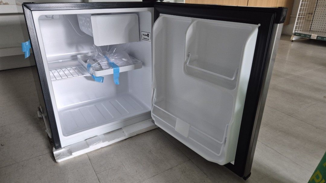 Fujidenzo Mini Refrigerator (Category: Refrigerators and Freezers) located in Quezon City. Submitted by chachu89 (Listing ID 1435600911, Image 3). Description: - Fujidenzo mini refrigerator - Heavy-duty compressor - Energy-efficient - Space-saving design - Dimensions: 485x490x525mm - Stainless steel exterior - Black door frame - Includes shelf and small compartment - Door opens to the right For pick up only. If shipping, the buyer will be the one