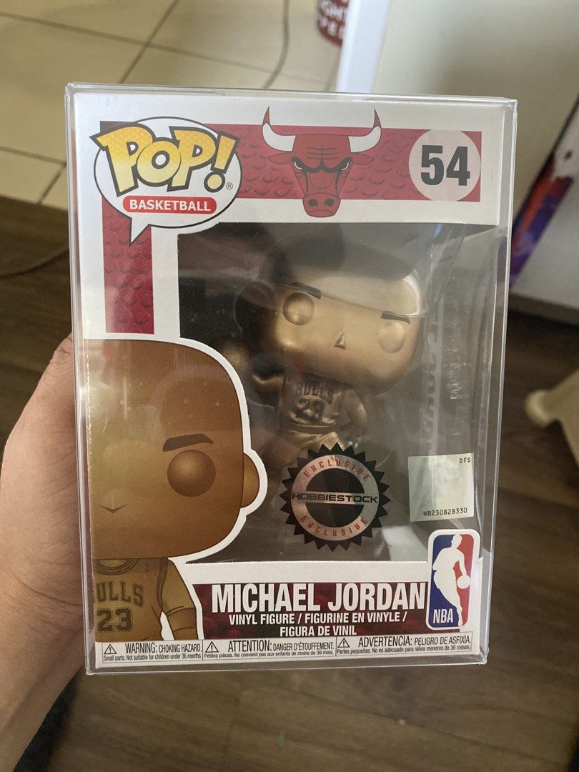 Funko Pop! Basketball Michael Jordan #54 (Category: Designer & Blind Box Toys) located in Quezon City. Submitted by markgatestv (Listing ID 1435542718, Image 1). Description: For sale For Micheal Jordan Collectors 10/10 fresh Almost Brandnew - Michael Jordan Funko Pop! figure - Gold-colored figure - NBA Basketball Series #54 - Features Michael Jordan in his Chicago Bulls uniform - In original packaging - Box includes NBA and Funko Pop! logos - Bo