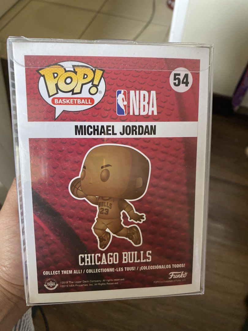 Funko Pop! Basketball Michael Jordan #54 (Category: Designer & Blind Box Toys) located in Quezon City. Submitted by markgatestv (Listing ID 1435542718, Image 3). Description: For sale For Micheal Jordan Collectors 10/10 fresh Almost Brandnew - Michael Jordan Funko Pop! figure - Gold-colored figure - NBA Basketball Series #54 - Features Michael Jordan in his Chicago Bulls uniform - In original packaging - Box includes NBA and Funko Pop! logos - Bo