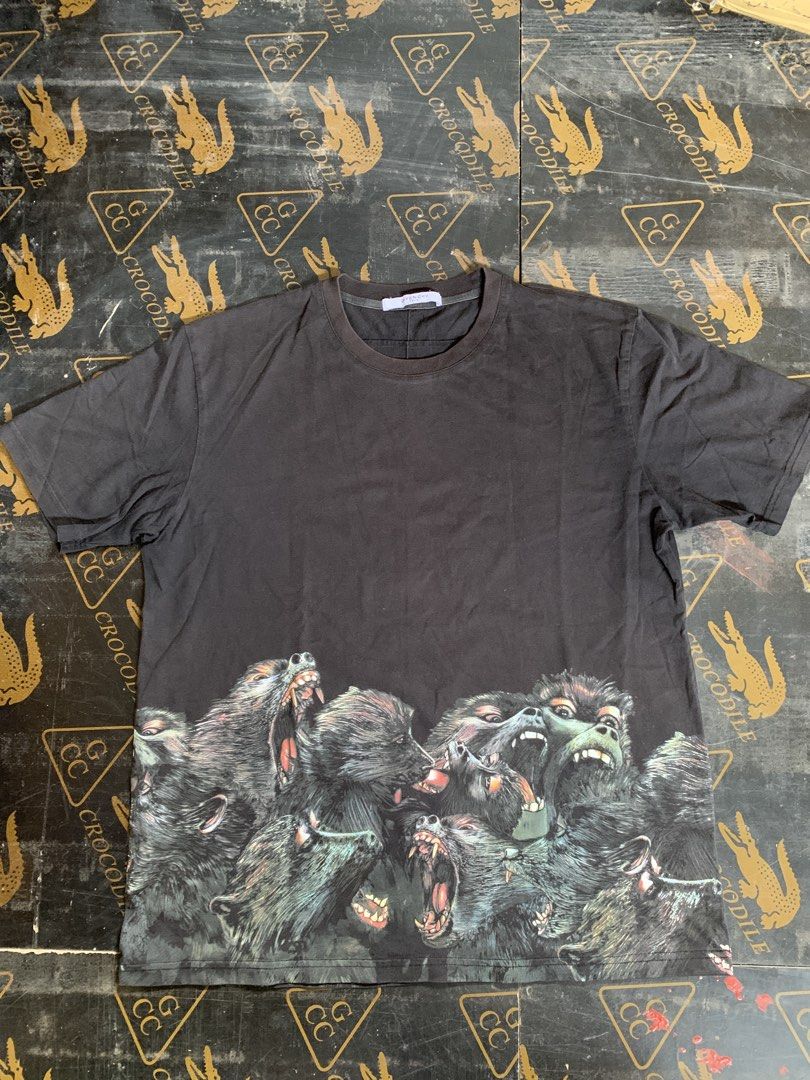 Givenchy Paris Graphic T-shirt (Category: Tshirts & Polo Shirts ) located in Baguio. Submitted by brix6699 (Listing ID 1435590332, Image 1). Description: - Black Givenchy T-shirt - Features a graphic print of snarling animals - Crew neck - Short sleeves - Givenchy Paris label visible - Tag partially detached -Size Xl -Color rate 7/10 - Dimensions Length 28 inches Width 22.5 inches.